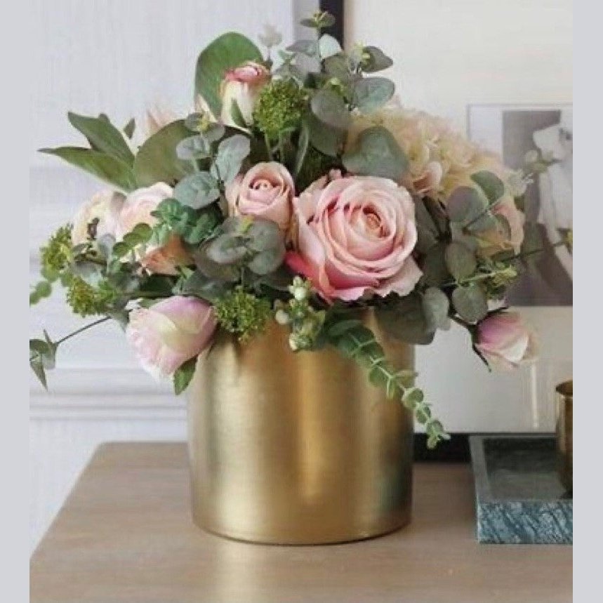 blush pink roses in a modern gold vase