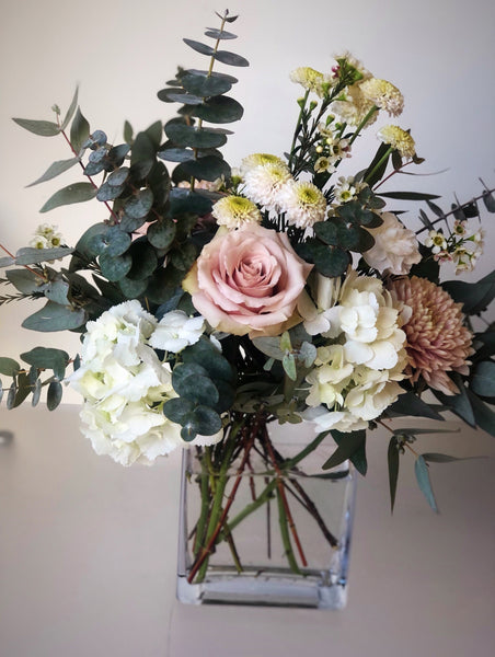 soft, modern flowers in a cleaver vase arrangement. flower delivery for mothers day in richmond, bc