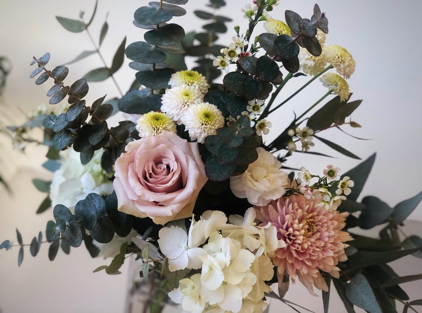 soft, modern flowers in a cleaver vase arrangement. flower delivery for mothers day in richmond, bc