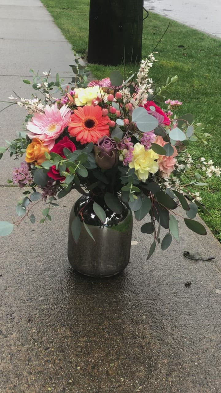 cheerful flowers in a silver vase arrangement. flower delivery for mothers day in richmond, bc