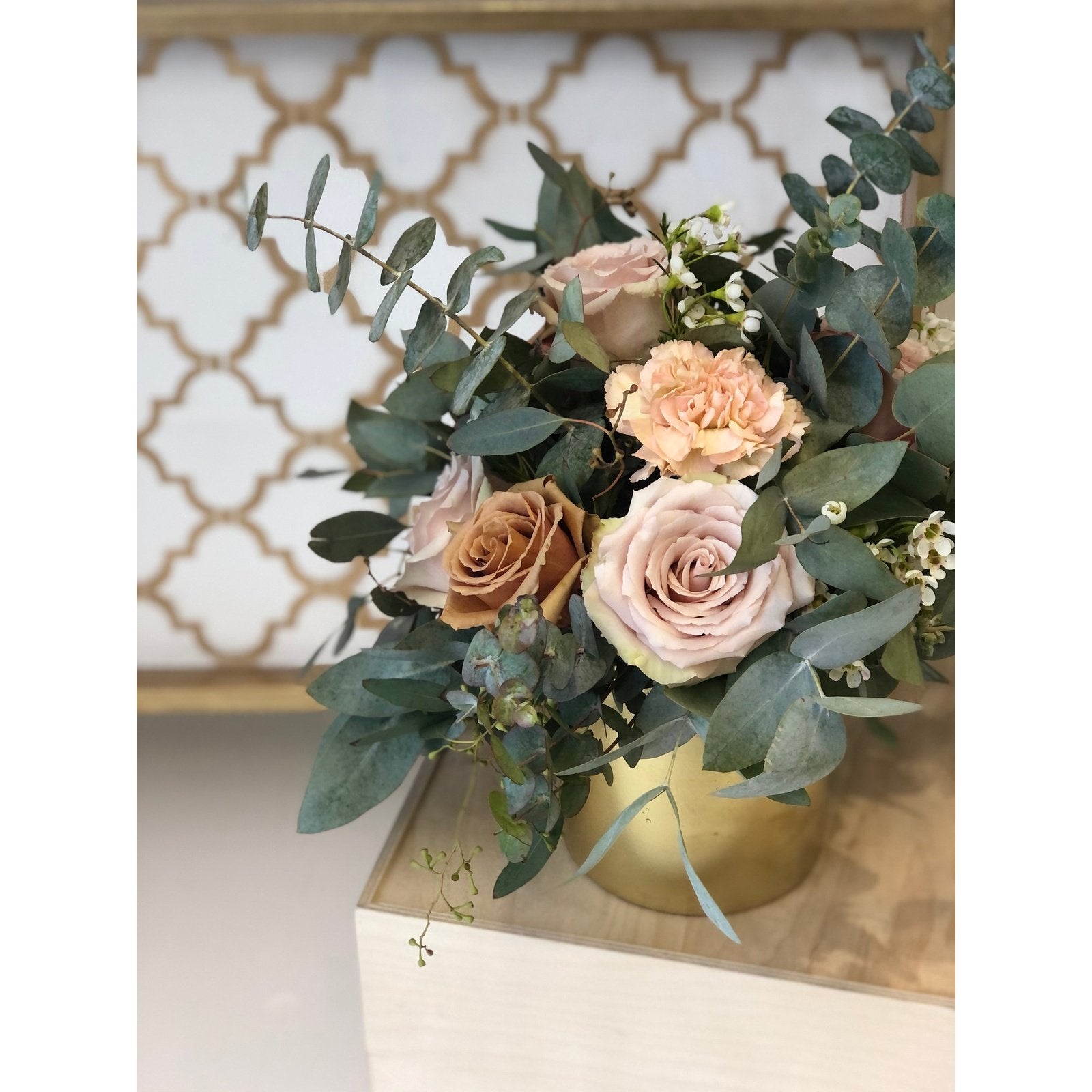 blush roses and Eucalyptus in gold vase