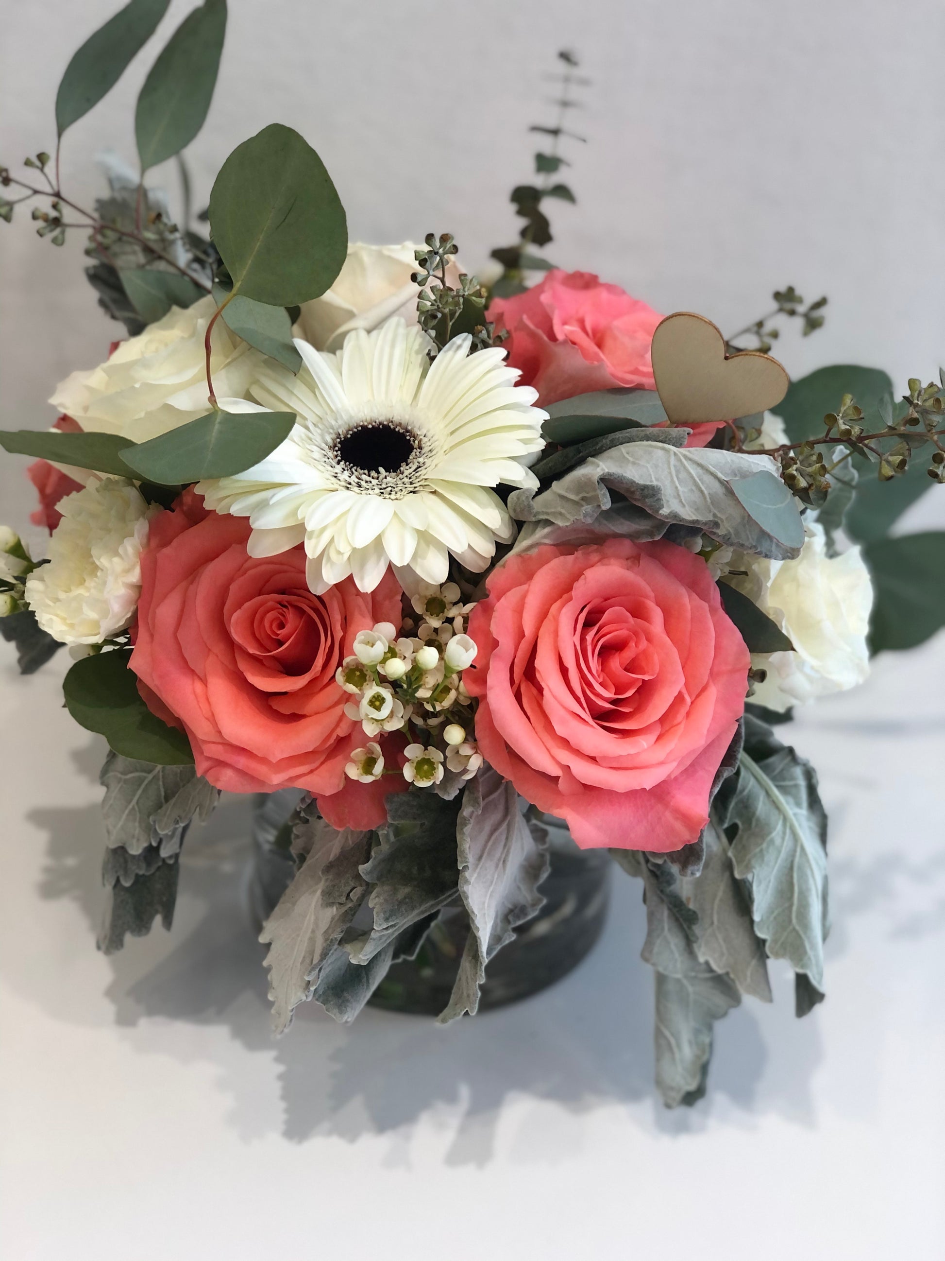 white gerber daisy pink roses dusty miller