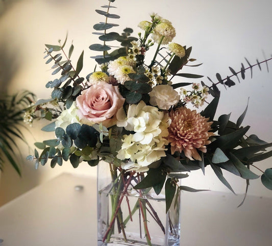 soft, modern flowers in a cleaver vase arrangement. flower delivery for mothers day in richmond, bc